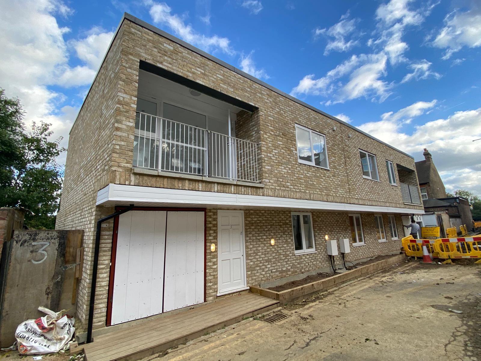 New build buff brick houses with balcony in Finchley, North London
